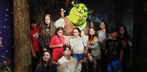 Young people with Shrek at Madame Tussauds