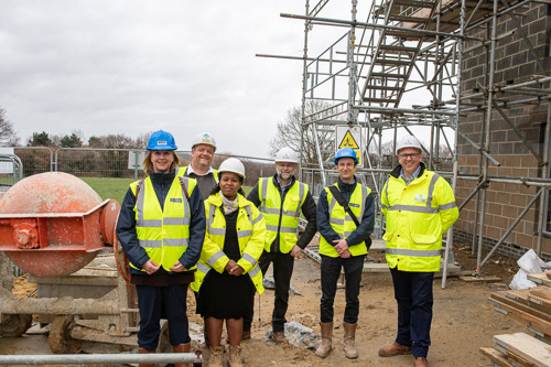 Staff from Helix and West Kent at building site