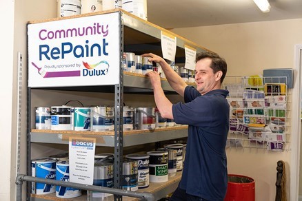 Stefano Collini, Abacus Warehouse Supervisor with some of the Community RePaint stock within the warehouse.)