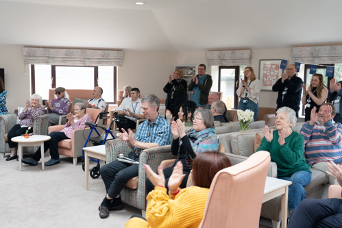 Guests clapping after presentation