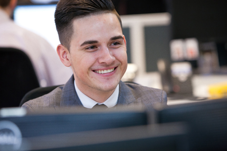 young man on work experience at a desk