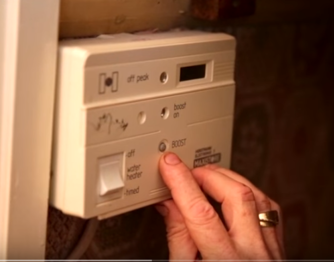 person testing boiler controls