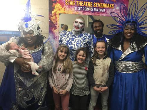 A family with the actors at the Sevenoaks panto