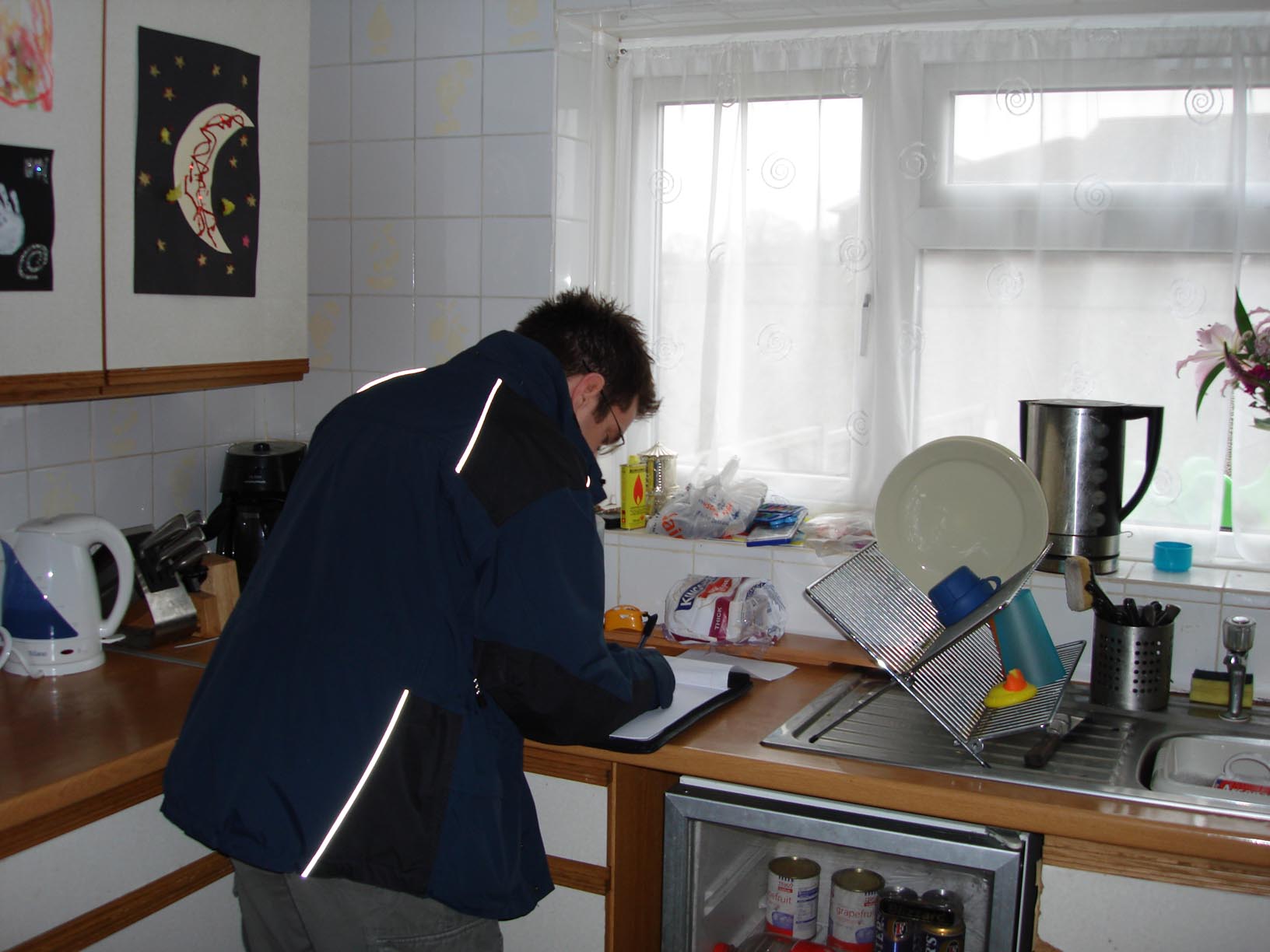 Engineer doing checks in a kitchen