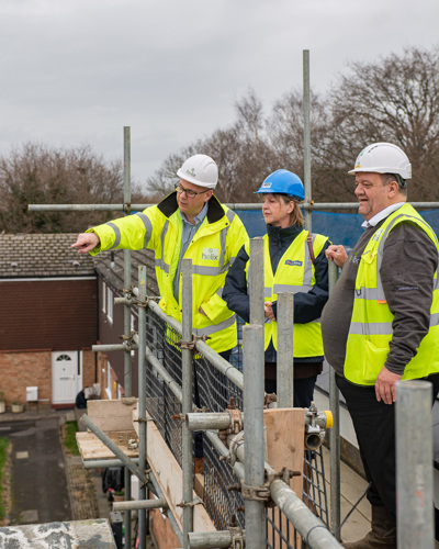 Staff at Helix and Tracy Allison, West Kent's Chief Executive touring a building development