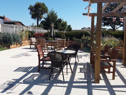 picture of the seating area and pergola in the copperfields garden