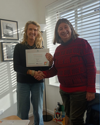 Peer to Peer group member receiving her certificate