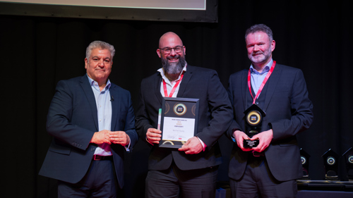 Photo of West Kent staff on stage receiving award